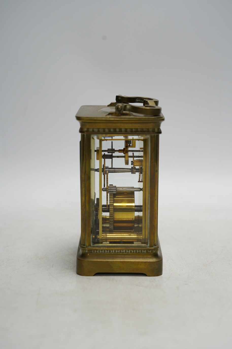 A brass cased carriage timepiece with enamel dial, with key, 15cm high. Condition - good, not tested